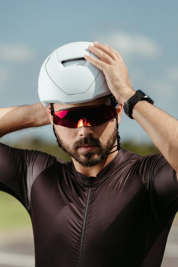 A man wearing a helmet and sunglasses